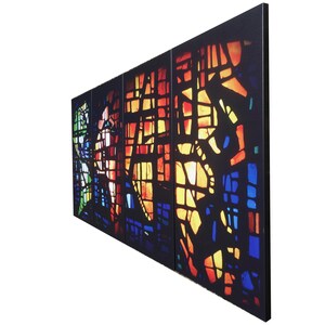 The image is a vibrant, colorful stained glass window with intricate patterns and designs.