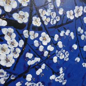 The image is a painting of white flowers on branches against a blue background.