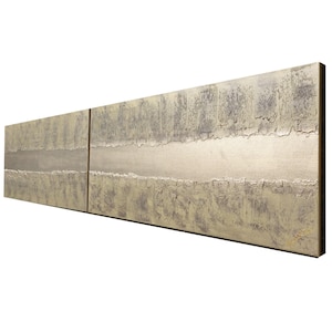 The image is a long, rectangular artwork with a textured, metallic surface. The artwork is composed of two distinct panels, each with a unique design and pattern. The overall composition creates a sense of depth and dimension, with the two panels placed side by side to create a continuous, flowing line across the image.