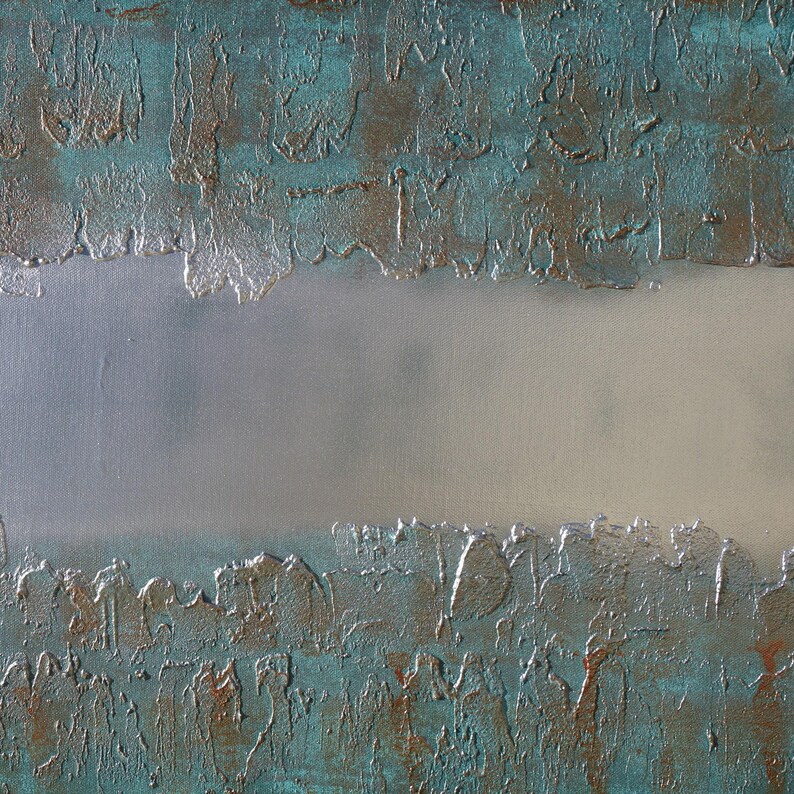 The image is a close-up of a textured surface with a metallic sheen, featuring a metallic sheen and a white background.