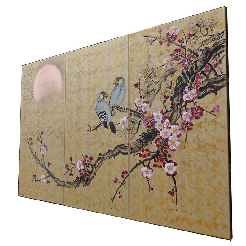 A large, three-panel painting depicting a pair of birds perched on a branch with pink and white flowers. The background features a large, round shape resembling a sun or moon.