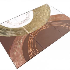The image is a rectangular canvas with abstract art featuring brown and gold colors, including curved lines and swirls.