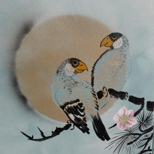 two birds perched on a branch, with a large sun or moon in the background.