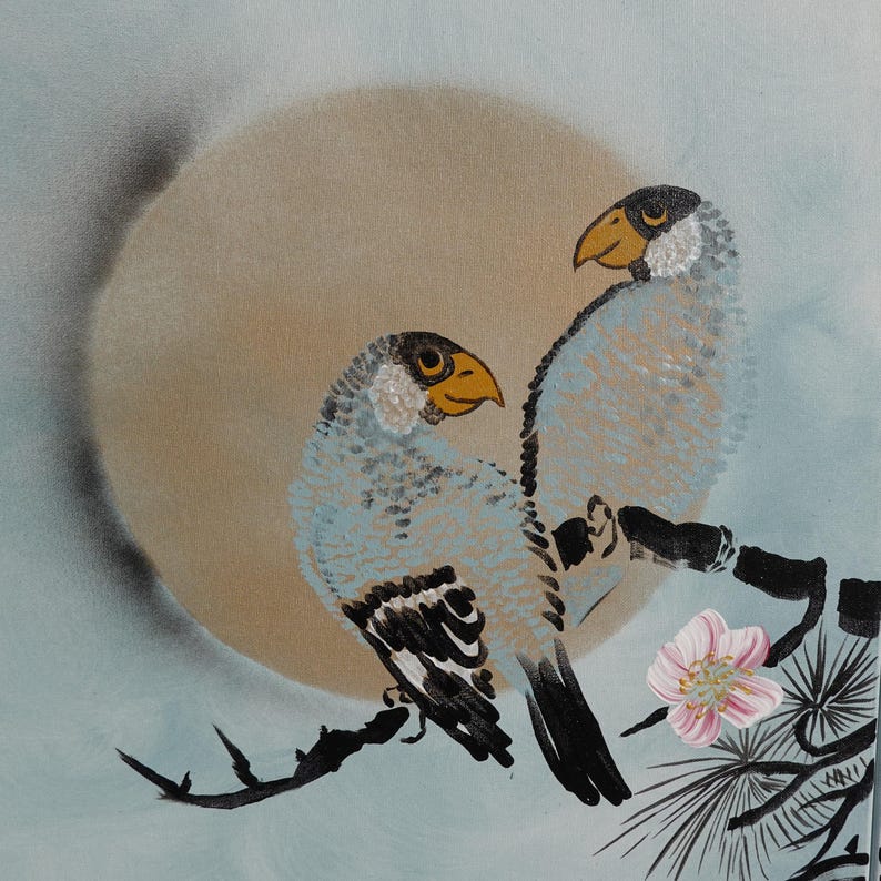 two birds perched on a branch, with a large sun or moon in the background.