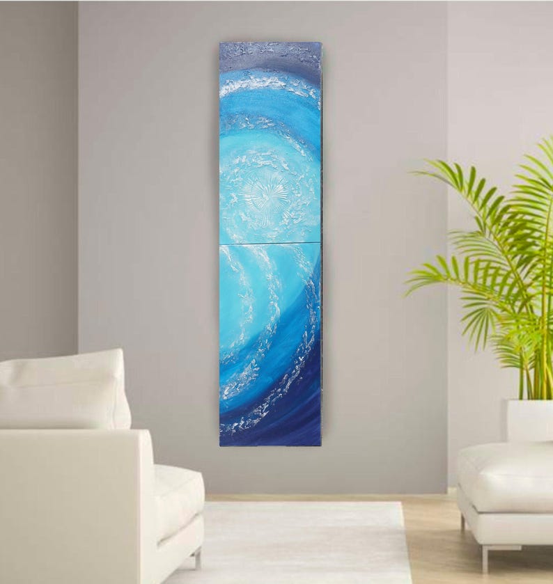a modern living room with a large, colorful abstract painting hanging on the wall. The painting depicts a swirling pattern of blue and white colors, creating a sense of movement and energy. The room is furnished with a white sofa and a potted plant, adding to the contemporary and minimalist aesthetic.