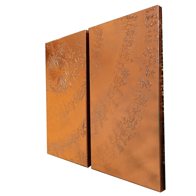 two rectangular panels with a metallic, textured surface. The panels are positioned side by side, creating a sense of symmetry in the composition.