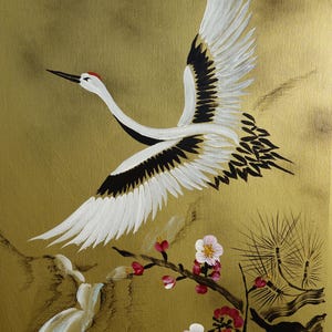 A white crane with outstretched wings is depicted in flight, surrounded by pink flowers and branches with green leaves.