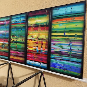 a vibrant, abstract painting with bold, colorful brushstrokes and a sense of movement across the canvas.
