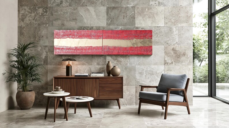a modern living room with a large window, a wooden sideboard, a gray armchair, a wooden coffee table, and a red abstract painting on the wall.