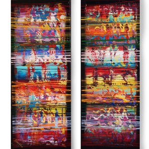 The image is a vibrant, abstract painting featuring a variety of bold colors and dynamic brushstrokes. The artwork is composed of multiple layers and elements, creating a visually striking and energetic composition.