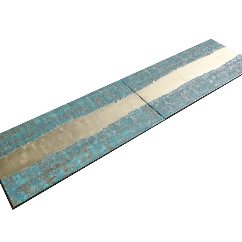 a long, rectangular surface with a textured pattern in shades of blue and white. The surface appears to be made of wood or a similar material, with a metallic or textured finish.