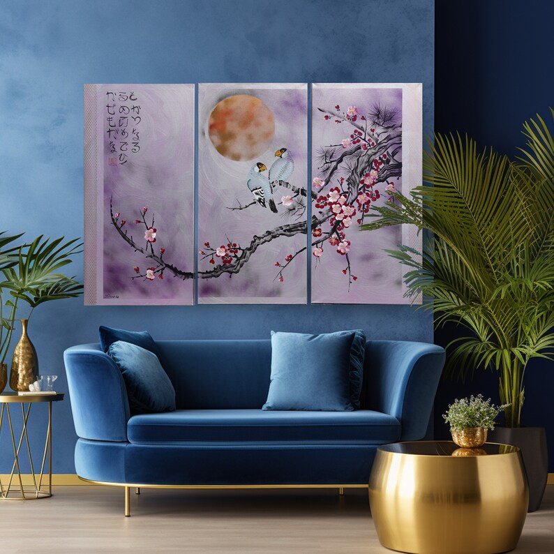 May include: A three-panel canvas print featuring a watercolor painting of a delicate pink cherry blossom branch with two blue birds perched on it. The background is a soft purple with a large orange moon in the center panel. The Japanese text on the left panel reads "つつむ さくら ひとひら の  こころ"