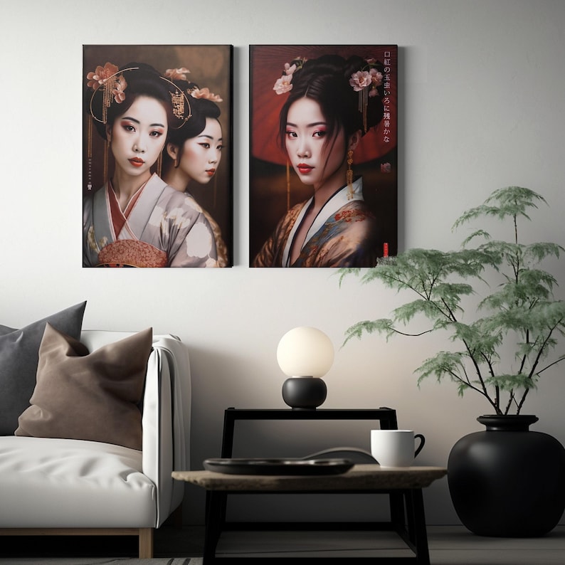 two framed artworks of women in traditional Japanese attire, hanging on a wall above a small table with a lamp and a plant.