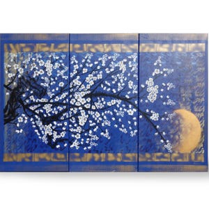 A triptych painting depicting a tree with white flowers against a blue background, with a large yellow moon in the background.