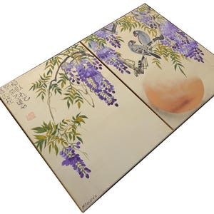 The image is a two-panel print featuring a floral design with purple flowers and birds. The panels are arranged diagonally, with the top panel showing a larger floral design and the bottom panel depicting a smaller bird. The overall composition is visually appealing and showcases the artistic talent of the creator.