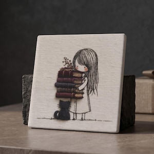 May include: A square white tile featuring a black line drawing of a person with long hair holding a stack of five books in shades of maroon, dark blue, and brown. A small black cat sits at the person's feet. The illustration has a textured finish.