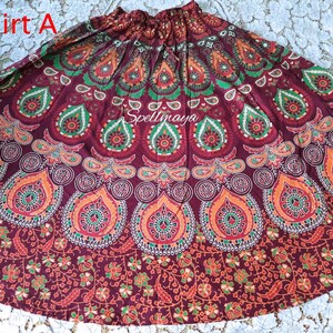 Pu&ograve; includere: Una gonna di colore marrone rossiccio con un design a mandala in rosso, arancione, verde e bianco. La gonna &egrave; realizzata in cotone e ha una vita con coulisse.