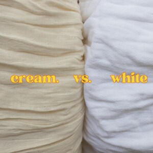 May include: Close-up of two fabric swatches, one cream and one white, side-by-side. The text "cream. vs. white" is printed in yellow on the fabric.