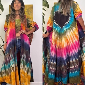 May include: A long, flowing tie-dye robe with a heart-shaped patch on the back. The robe is in shades of pink, orange, yellow, blue, and green.