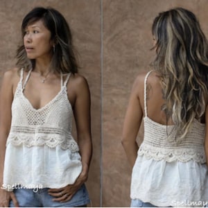 May include: A cream-coloured crochet top with a V-neck and spaghetti straps. The top has a scalloped edge and is combined with a white, embroidered bottom. The image shows the front and back of the top.