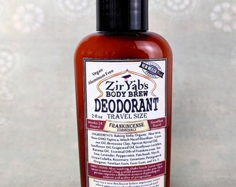 May include: A 2 fl oz travel size bottle of Zir Yab's Body Brew Deodorant in Frankincense (Original). The bottle is brown glass with a black cap and a white label with the product name and ingredients. The label also states that the product is vegan, aluminum free, and certified New Mexico produced.
