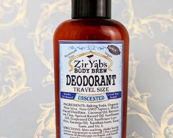 May include: A brown glass bottle of Zir Yab's Body Brew Unscented Deodorant, travel size, with a blue and white label. The label states that the product is aluminum free, vegan, and good-bye stains. The ingredients are listed on the label, including baking soda, organic aloe vera, non-GMO tapioca, witch hazel distillate, coconut oil, bentonite clay, apricot kernel oil, sunflower oil, grapeseed oil, sunflower lecithin, karanja oil, xanthan gum, guar gum, and vitamin E. The bottle is 2 fl oz.