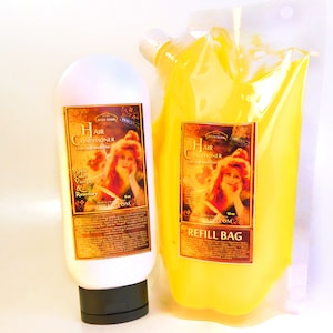 May include: Two bottles of hair conditioner, one in a clear plastic refill bag and the other in a white bottle with a black cap. Both bottles have a vintage-style label with a woman's portrait and the text "Hair Conditioner Leave in or Wash Out". The refill bag label also says "Refill Bag".