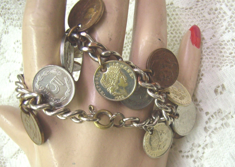 Summer Sale...Vintage Coin Bracelet....15 Coin Dangles...Argentina....Belgique...Peruana...Silver Metal Coin Charm Bracelet