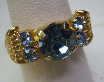 Vintage Blue Sapphire Crystal Rhinestone Cocktail Ring....Etruscan Gold Border/Band...Adjustable...Size 7 1/2