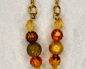 Gold and rust color beads dangle pierced earrings