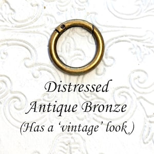 May include: Distressed antique bronze key ring with a vintage look.