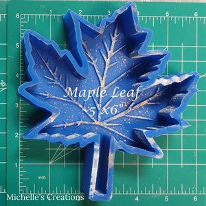 Silicone mold for car freshies - fall leaf freshy mold on top of measuring mat