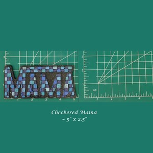 May include: Checkered mosaic tile art with the word "MAMA" in blue and white tiles on a black background. The art is approximately 5 inches by 2.5 inches.