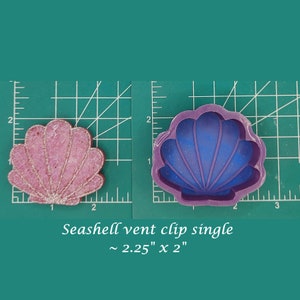 May include: A purple silicone seashell mold for making resin crafts. The mold is 2.25 inches by 2 inches.