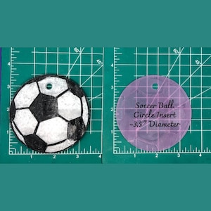 May include: A white and black soccer ball with a 3.5 inch diameter circle insert template. The template is pink and has a grid pattern.