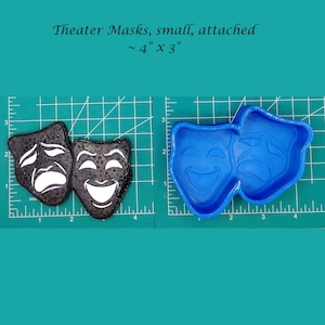 May include: Two black and white theater masks, one smiling and one frowning, attached together. The masks are approximately 4 inches by 3 inches. A blue silicone mold of the same masks is shown next to the masks.