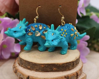 Teal triceratops earrings