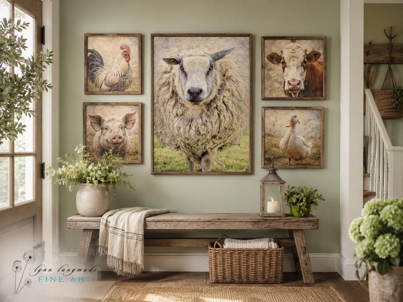 May include: A gallery wall arrangement featuring five framed prints of farm animals including a rooster, a pig, a sheep, a cow, and a duck. The prints are displayed above a wooden bench with a woven basket and a throw blanket underneath.
