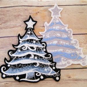 May include: Two Christmas tree patches. One is black with white and light blue embroidery, and the other is white with light blue and gray embroidery. Both have a star on top and decorative swirls and hanging ornaments.