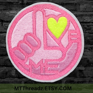 May include: A set of three ceramic mugs with a speckled, matte finish. The mugs are in shades of cream, light brown, and dark brown. Each mug has a simple, minimalist design and a rounded handle.