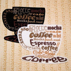 May include: Two embroidered coffee cup designs. One is black with white text and the other is white with brown text. Both designs feature the words "coffee", "latte", "mocha", "espresso", "cappuccino", "cafe au lait", and "french roast".