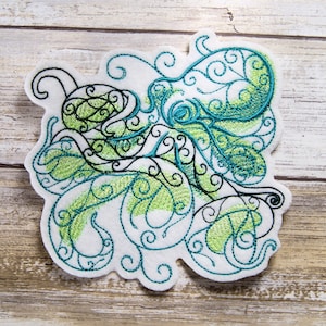 May include: Embroidered patch featuring a stylized octopus with swirling tentacles in shades of green and teal on a white background.