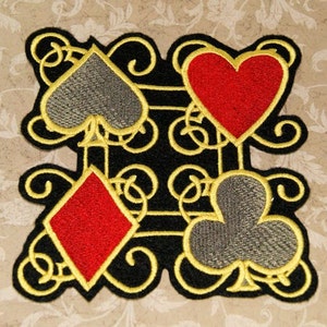 May include: Black fabric patch with four embroidered playing card suits: a red heart, a red diamond, a gray spade, and a gray club. The suits are outlined in gold thread and set against a black background with gold scrollwork.