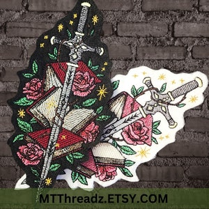 May include: Embroidered patch featuring two swords crossed over a stack of books, surrounded by roses and stars. The patch is black and white with red accents. The text "MTTthreadz.ETSY.COM" is at the bottom of the patch.
