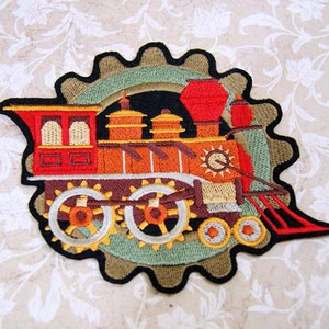 May include: An embroidered iron-on patch featuring a red, orange, and brown vintage steam train with a large gear design. The train has a large smokestack and a detailed front with a sun design.