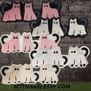 May include: A set of 10 felt ghost cat appliques in pink, white and beige. The ghosts have black eyes and a black tail. The appliques are perfect for adding a spooky touch to your Halloween crafts.