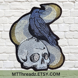 Black Raven Patch Spooky Crow sitting on a Human Skull Gothic Corvid Patch Iron On Embroidery Patch