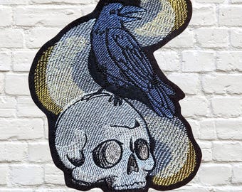 Black Raven Patch Spooky Crow sitting on a Human Skull Gothic Corvid Patch Iron On Embroidery Patch