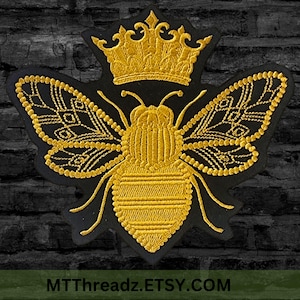 May include: Embroidered patch featuring a golden bee wearing a crown, set against a black background. The bee has detailed wings and body, with a decorative crown above its head. The text "MTThreadz.ETSY.COM" is at the bottom.
