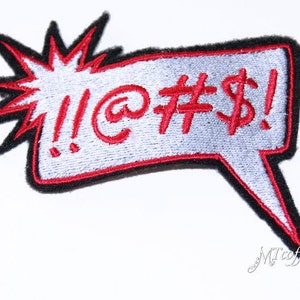 May include: Red embroidered patch with a speech bubble and the text "!@#$!" in a white background.